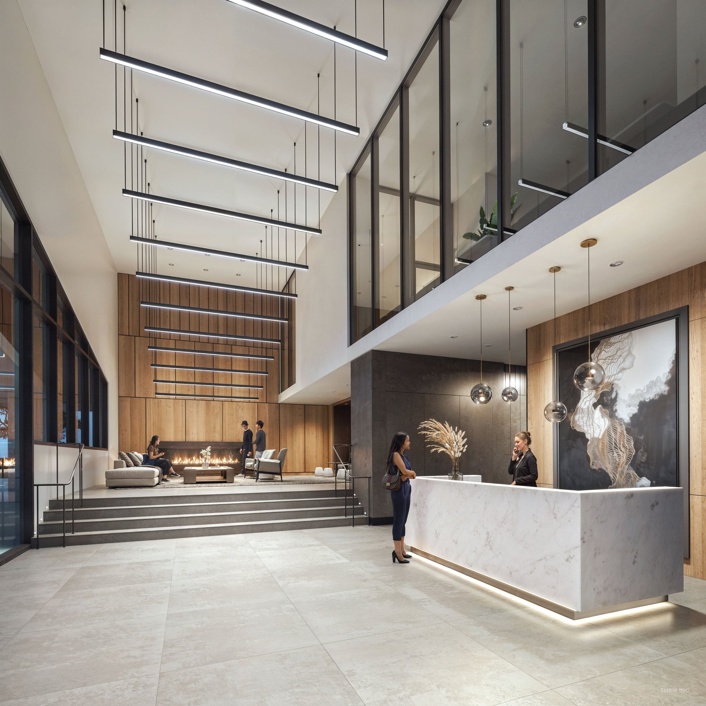 Double height lobby with wood panelling, seating and tall windows