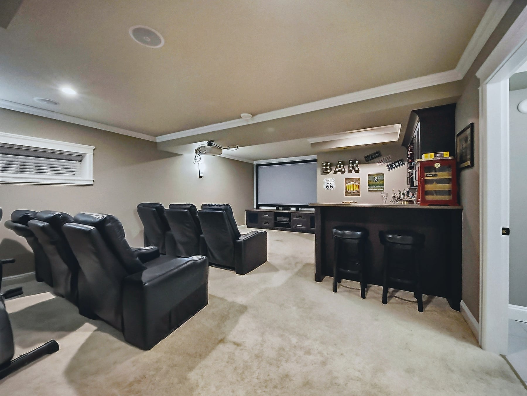 Home cinema with a projection screen and theatre seating