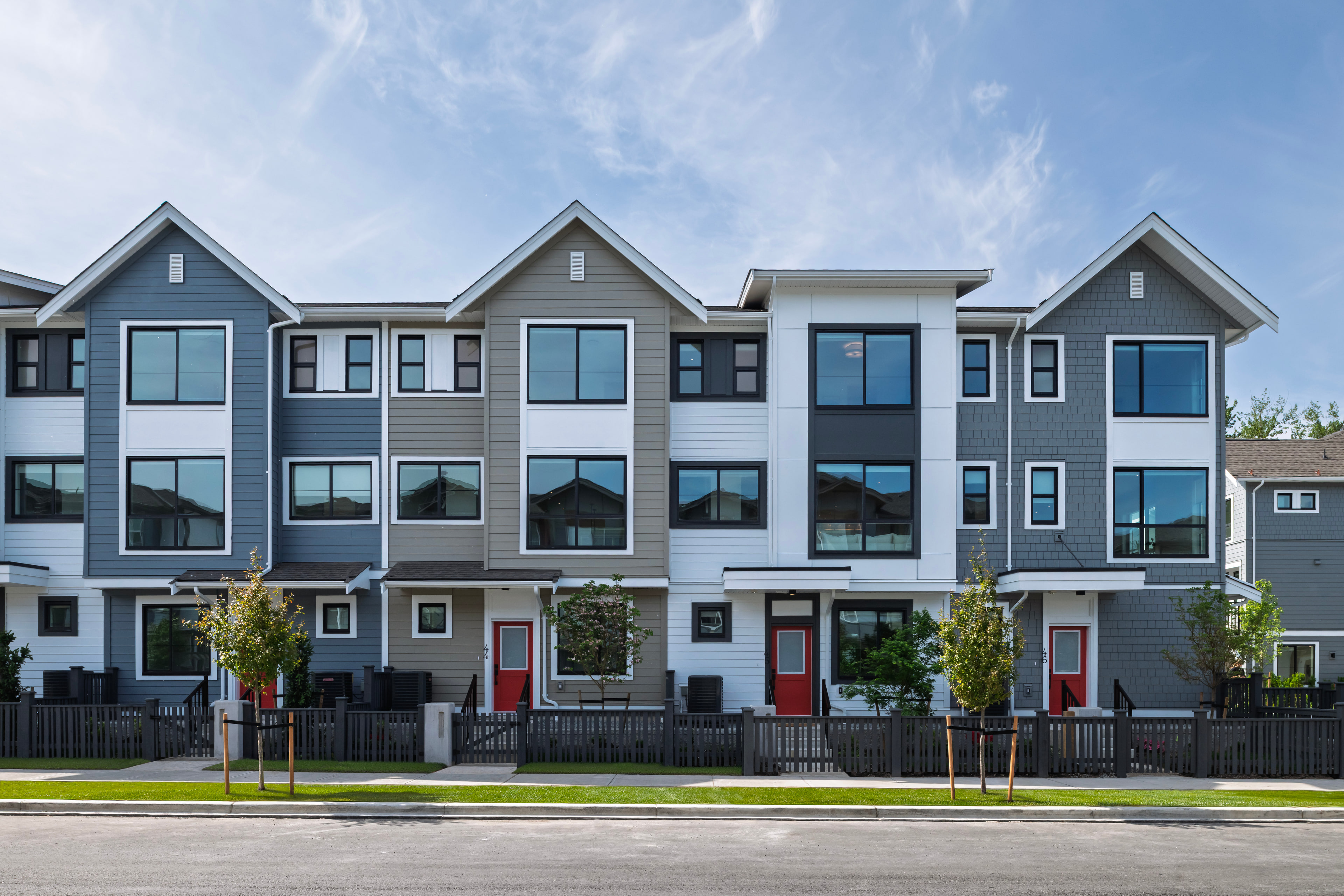 A row of Silverbrook townhomes under a clear sky
